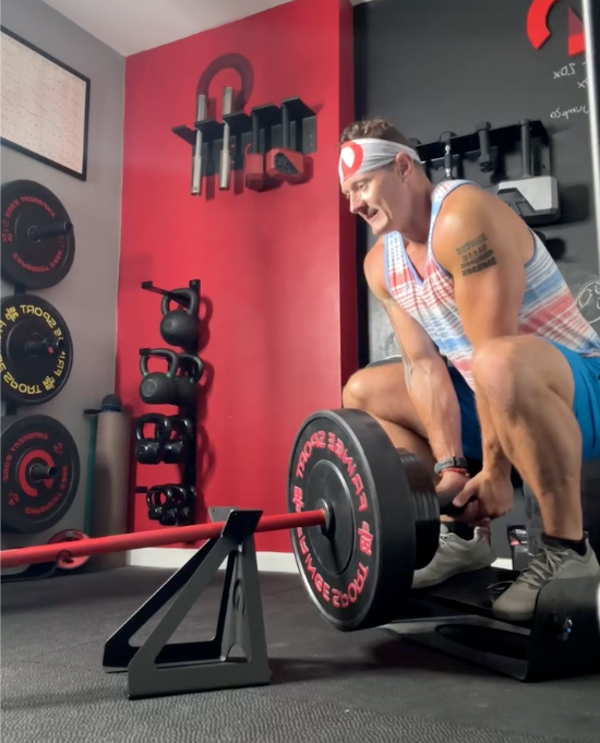 Man performing deep landmine squats with the landmine jack and flex wedge with Exponent Edge