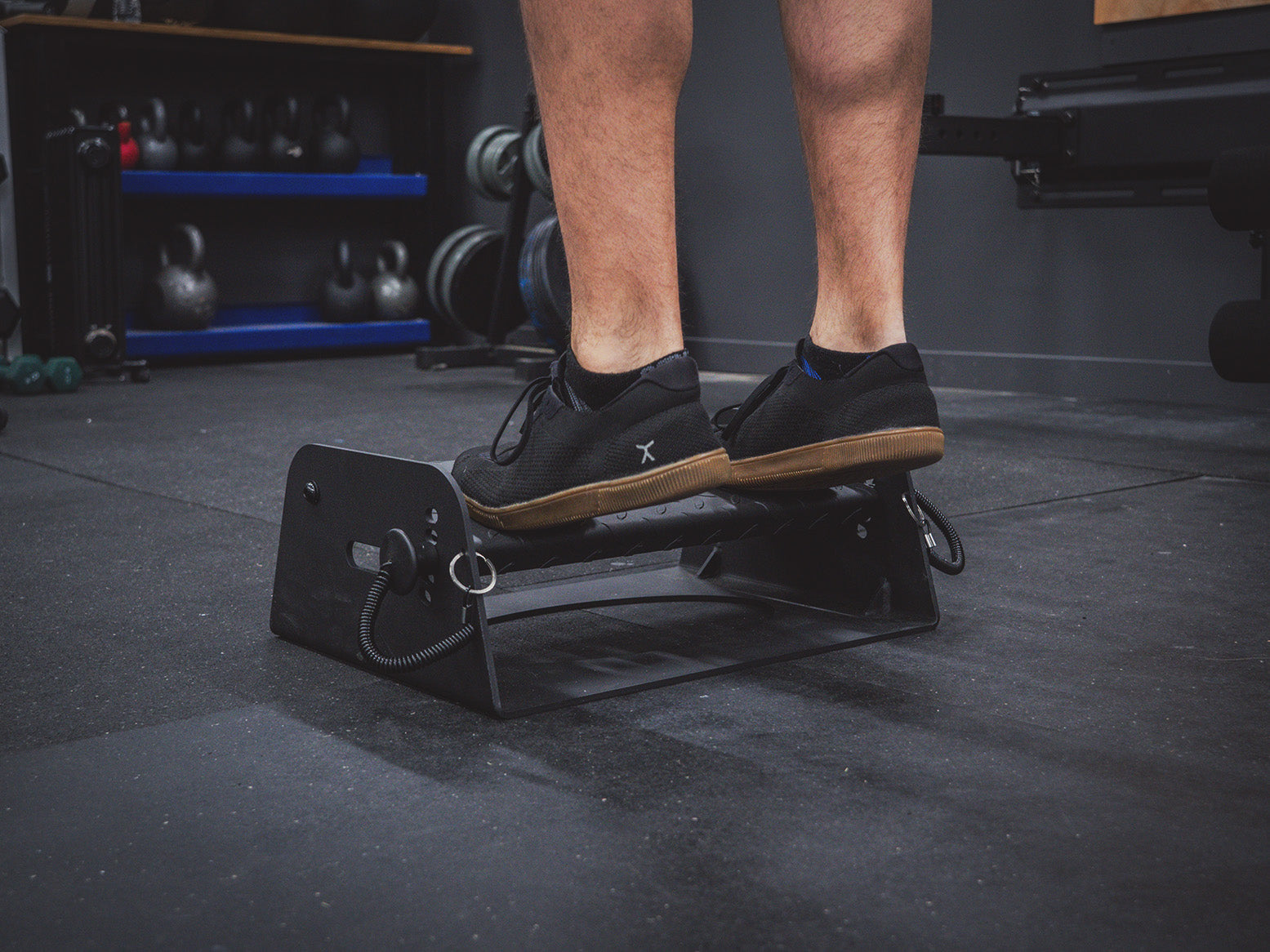 Man doing calf raises on the Flex Wedge by Exponent Edge