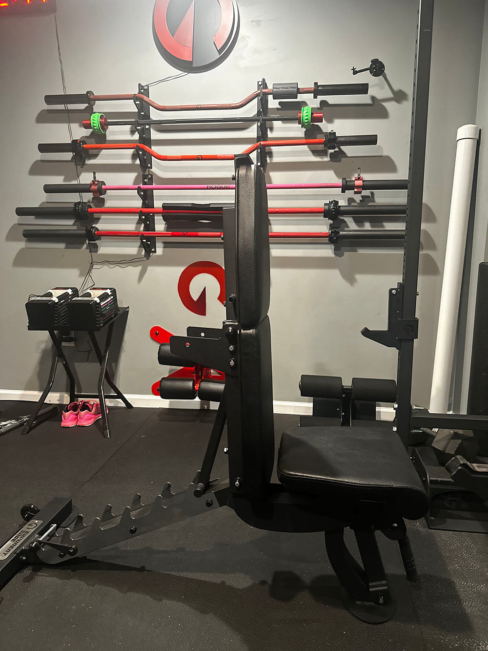 The Edge Infinity Bench is a bench that combines three separate benches all into one bench. You get the benefits of a flat bench, incline bench, and half bench all in one device. This image presents the bench from a side view with the back support fully vertical.