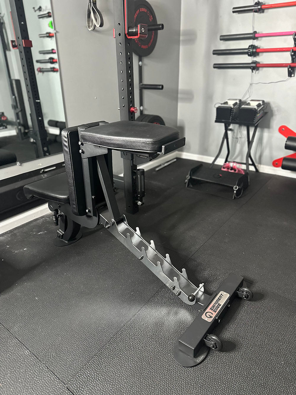 The Edge Infinity Bench is a bench that combines three separate benches all into one bench. You get the benefits of a flat bench, incline bench, and half bench all in one device. This image presents the bench from a behind view.