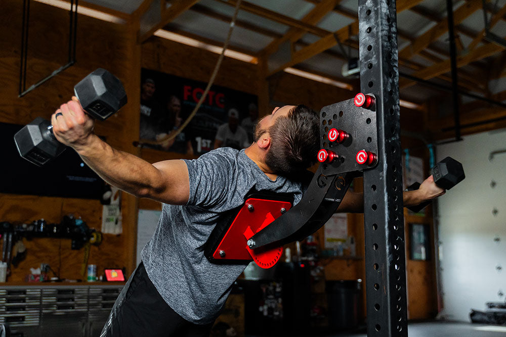 The rack-attaching, Infinity Arm can be utilized for chest-supported, arm-supported, back-supported, head-supported, and many other supported exercises. This image presents the Infinity Arm being used for chest exercises in a home gym.