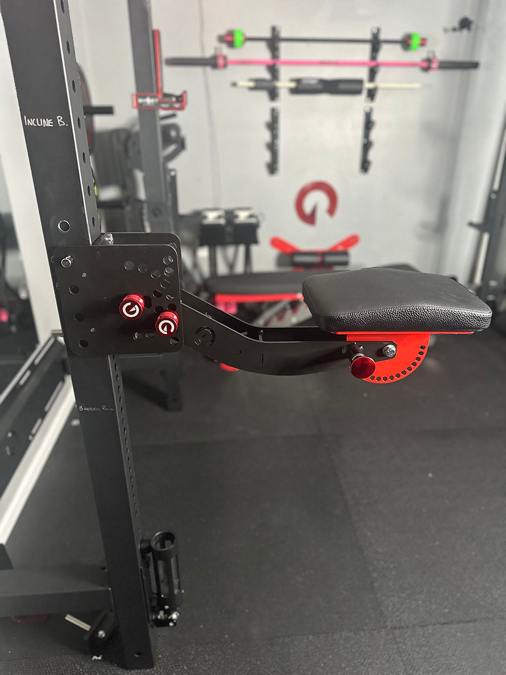 The rack-attaching, Infinity Arm can be utilized for chest-supported, arm-supported, back-supported, head-supported, and many other supported exercises. This image presents the Infinity arm in a home gym attached to a rack.