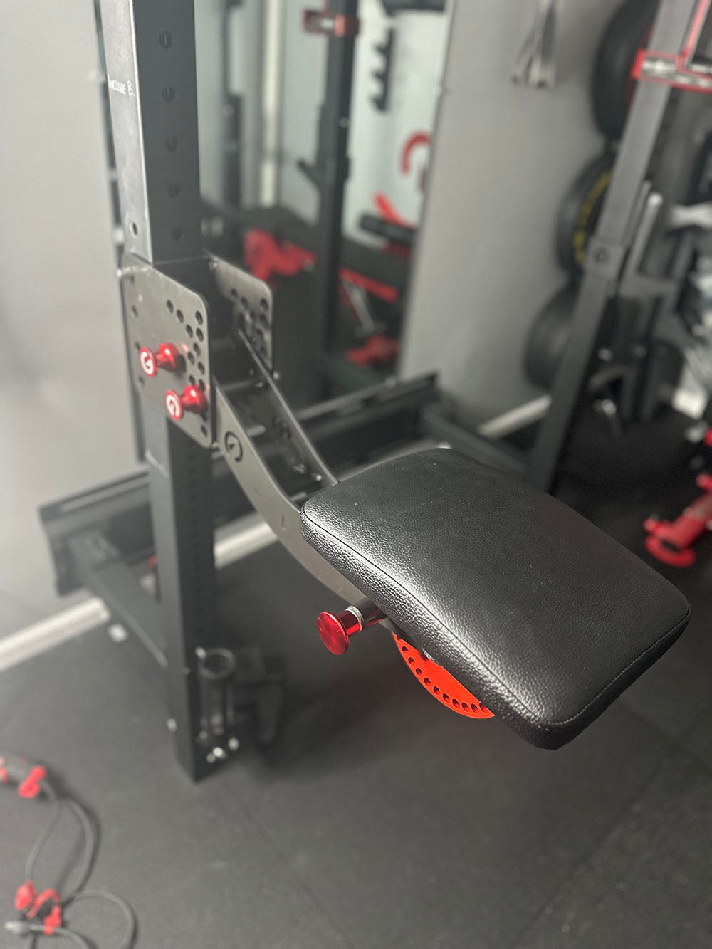 The rack-attaching, Infinity Arm can be utilized for chest-supported, arm-supported, back-supported, head-supported, and many other supported exercises. This image presents the Infinity Arm from an upper view connected to a workout rack.
