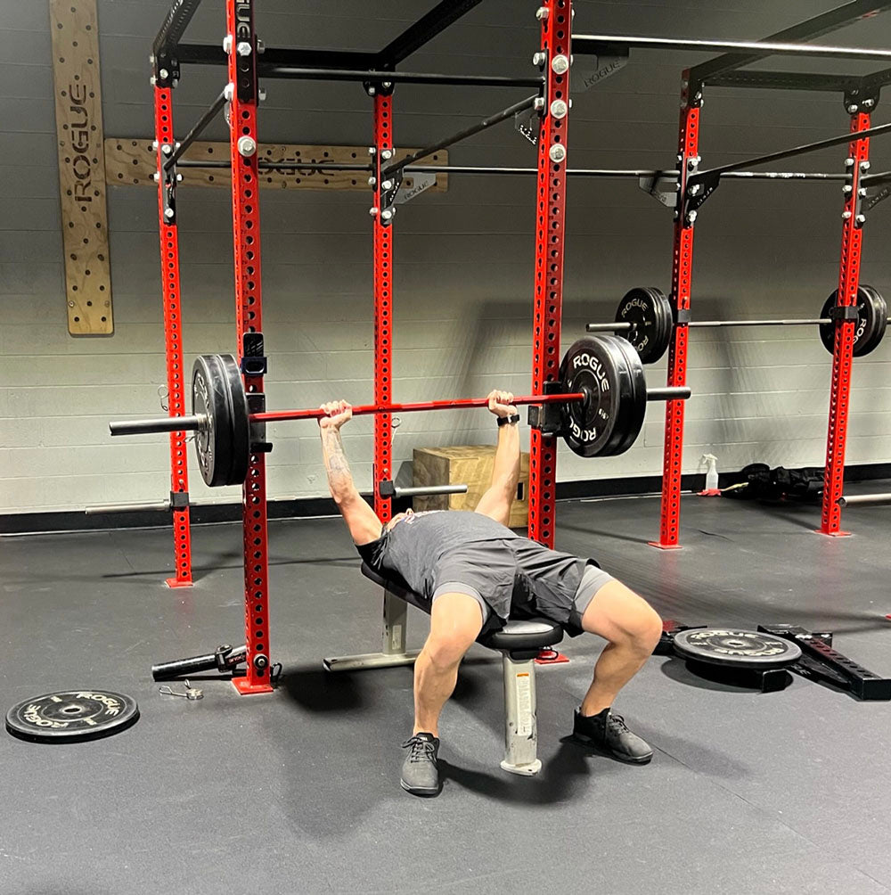 The Infinity Bar is a hybrid Bodybuilding and Powerlifting barbell. This images presents the Infinity Bar being used for a chest workout.