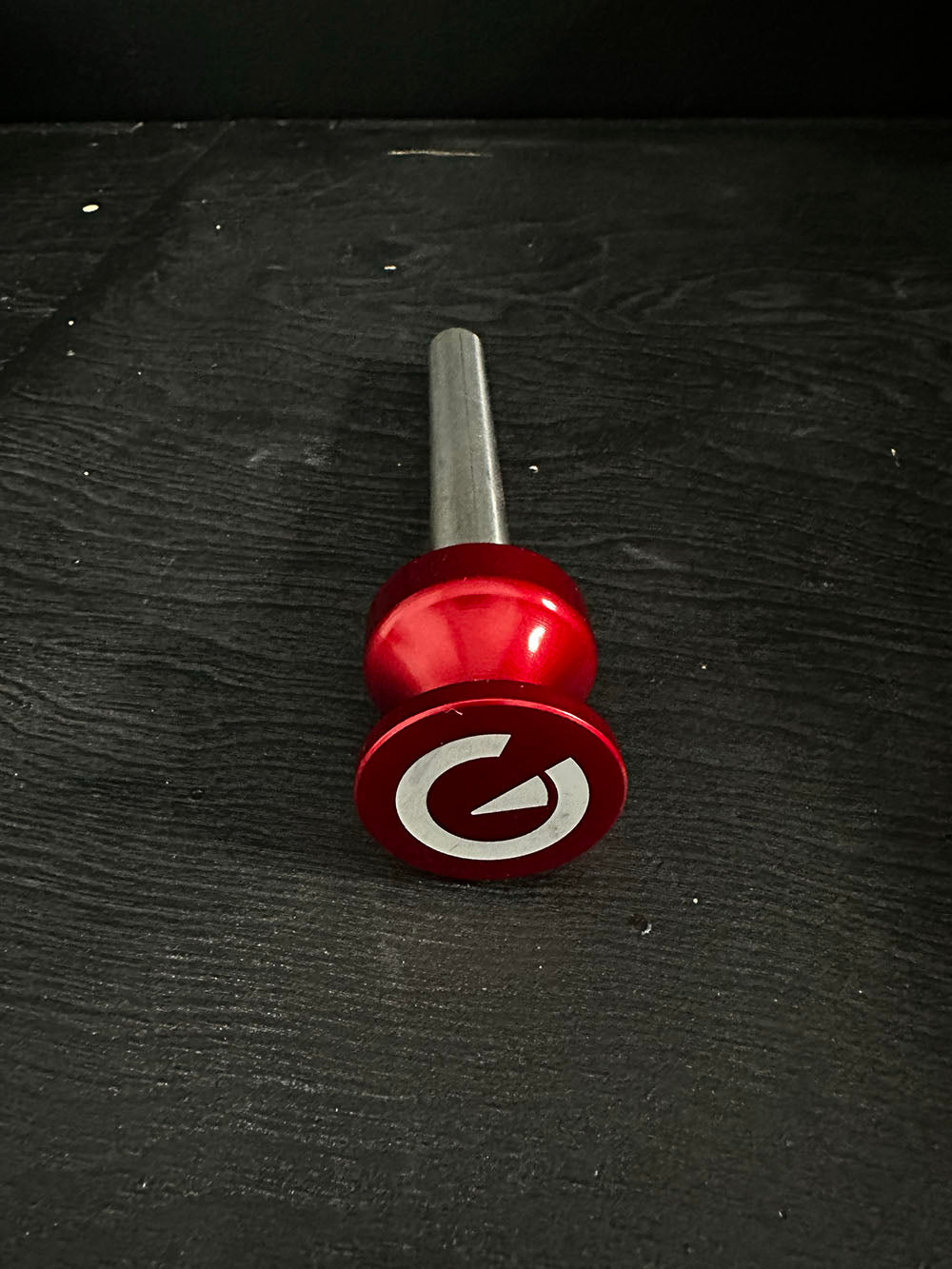 Custom Exponent Edge Magnetic pins fit all major brands of squat racks, power racks, and accessories, including Exponent Edge workout equipment. This image presents the Magnetic Edge Pin in red from a close-up, front view.
