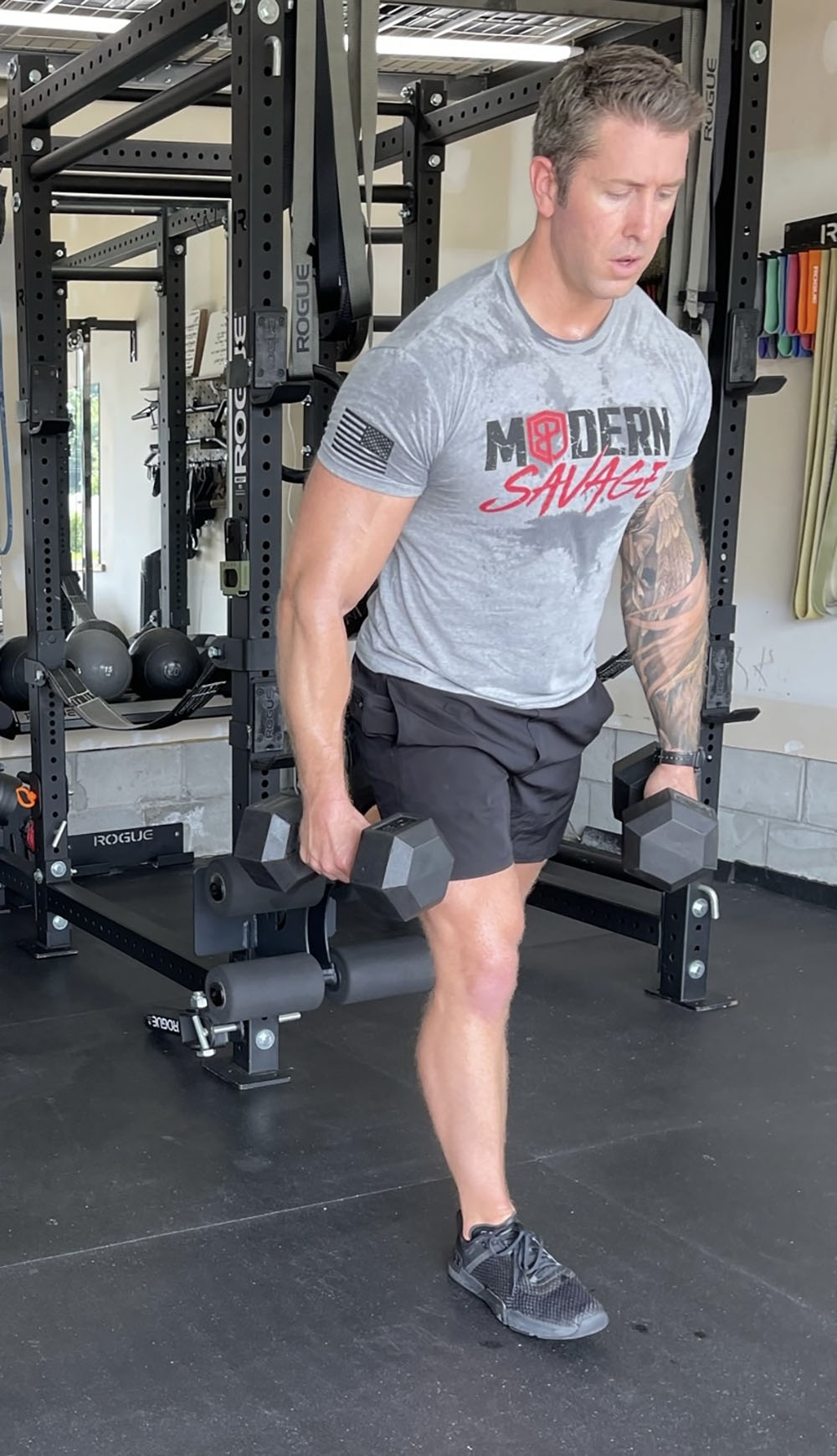 This Rack Mounted Glute Ham Developer is less bulky and lower priced than conventional GHDs. Perfect for glute workouts, ab workouts, and hamstring workouts. This image presents the Rack Mounted Glute Ham Developer being used for a leg workout.