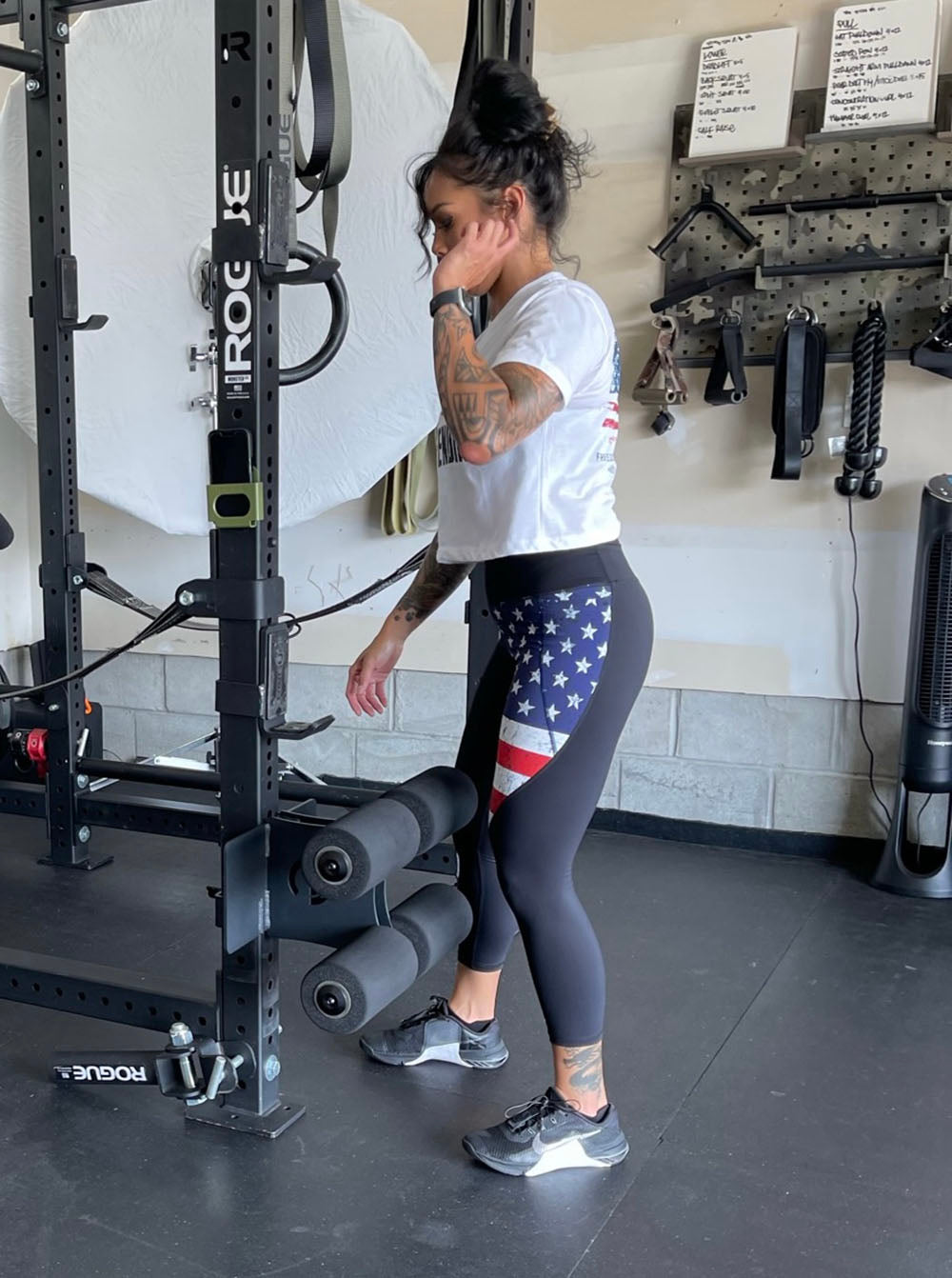 This Rack Mounted Glute Ham Developer is less bulky and lower priced than conventional GHDs. Perfect for glute workouts, ab workouts, and hamstring workouts. This image presents the Rack Mounted Glute Ham Developer being attached on a power rack in a garage gym.